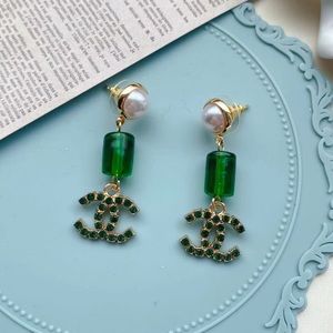 Chanel green earrings with glass bead and pearl